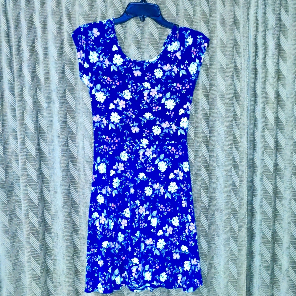 Sleeveless mini with cut outs in back.